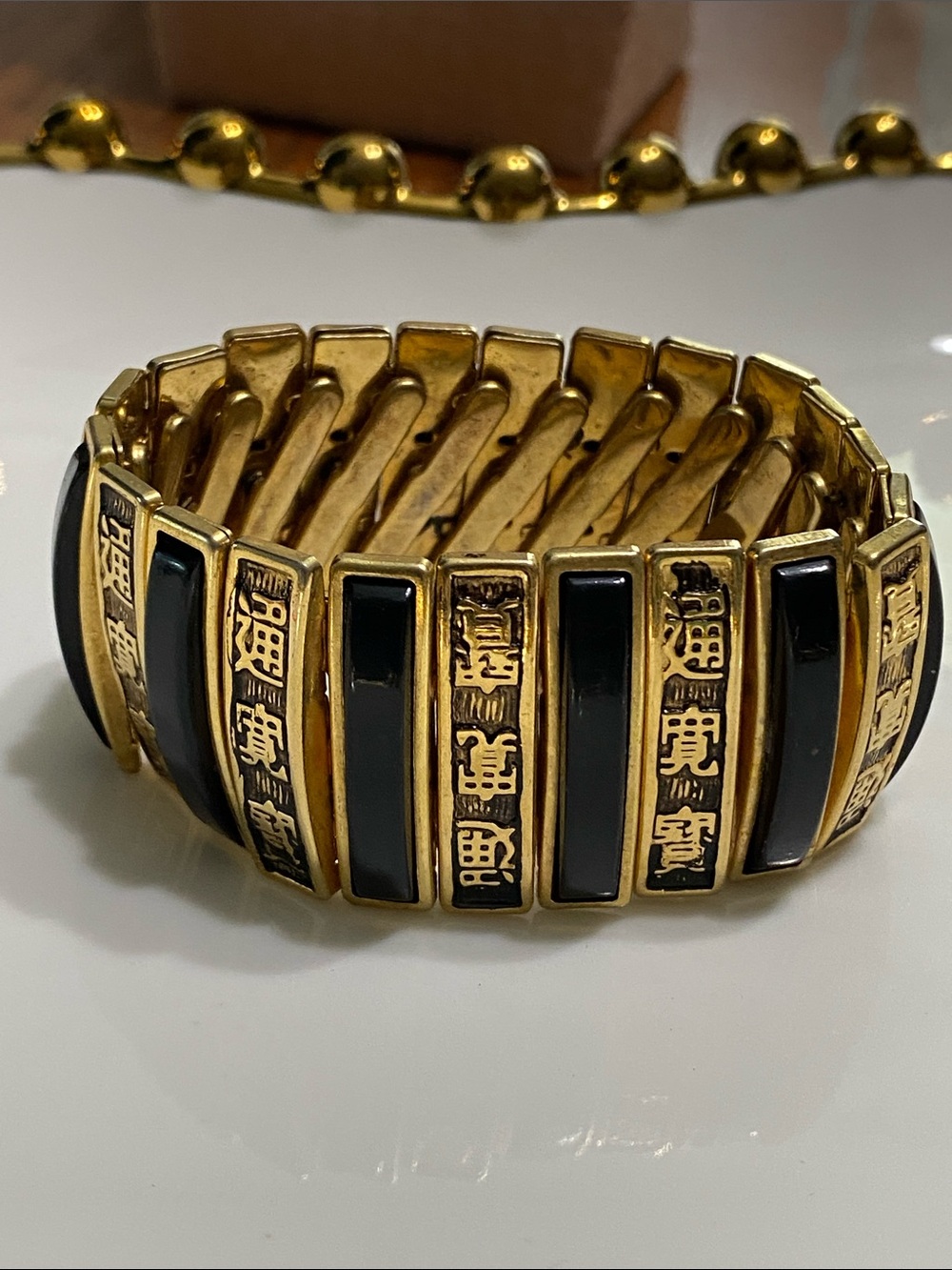Gold and Black Chinese Stretch Bracelet with Oriental Inlay